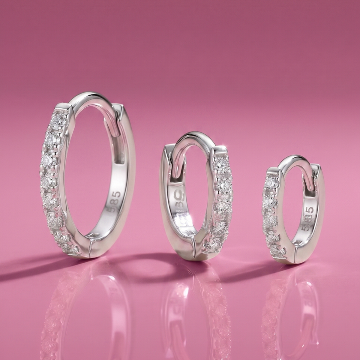 Upgrade your ear stack with white gold diamond huggies